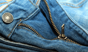 Close-up of a zipper on jeans. Sometimes you have to stretch your jeans to get a comfortable fit.