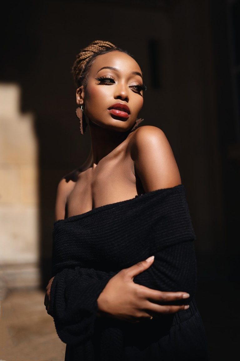 Inclusive fashion meets street style in this urban editorial shot, featuring a bold, gender-neutral outfit with sleek, minimalist flair and moody elegance.