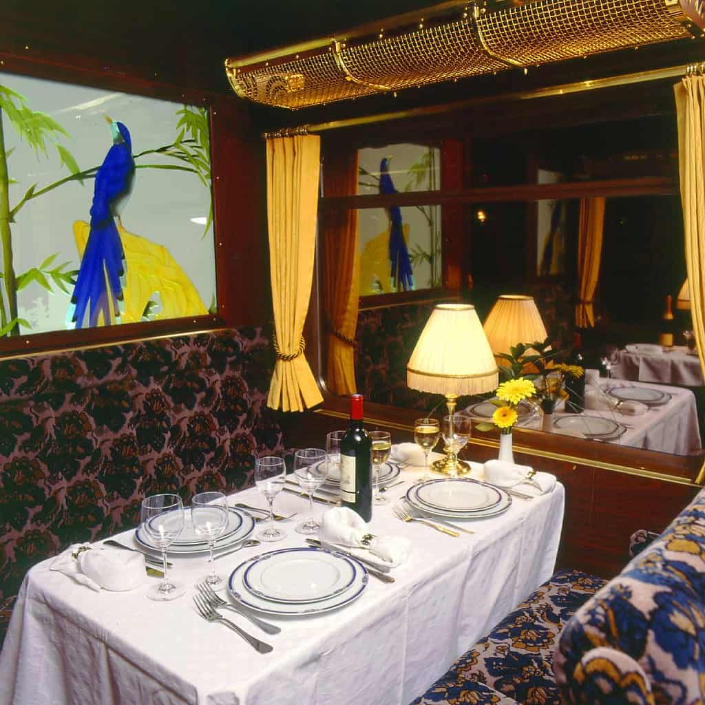 Luxury train travel, "Swiss luxury train's dining carriage" by Luxury Train Club is licensed under CC BY-SA 2.0