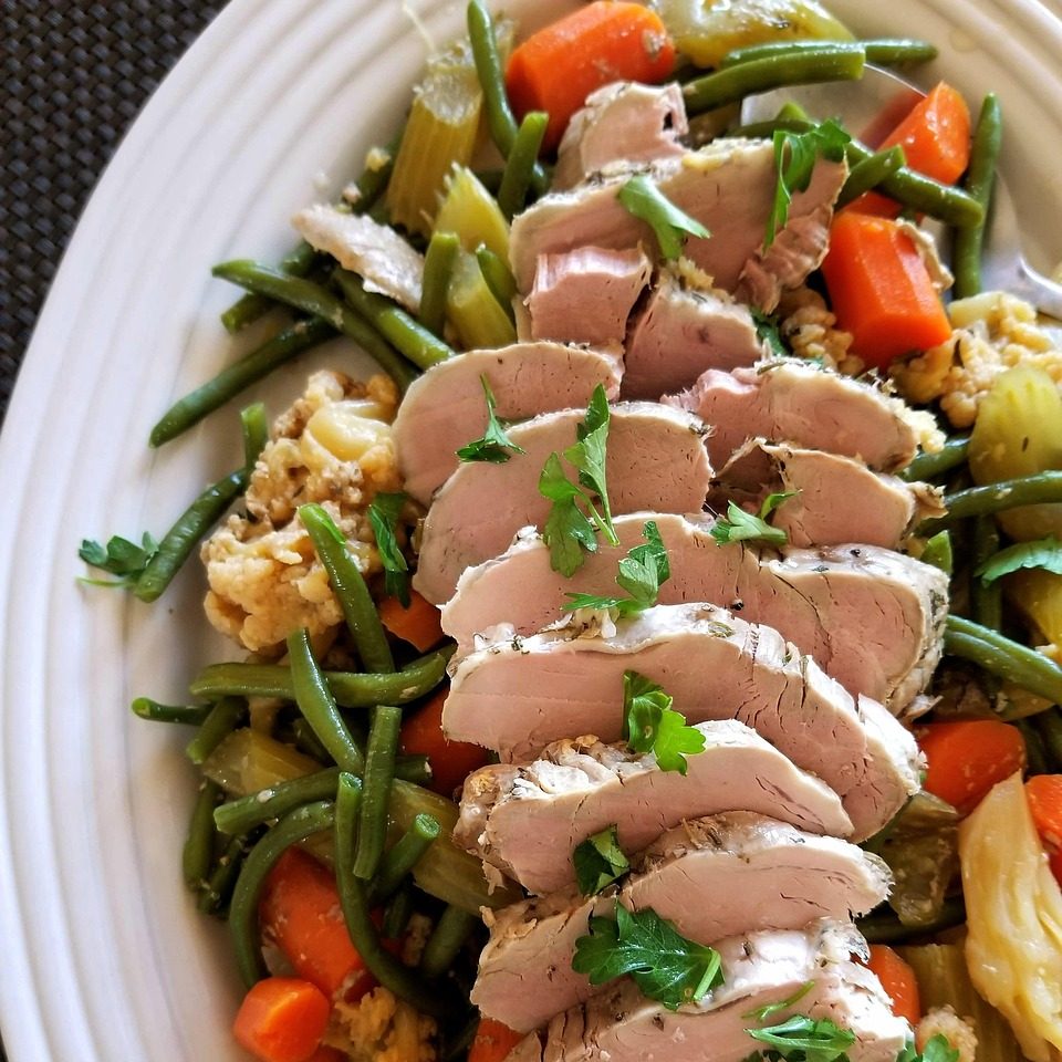 Stuffed turkey breast and vegetables for Friendsgiving dinner. 